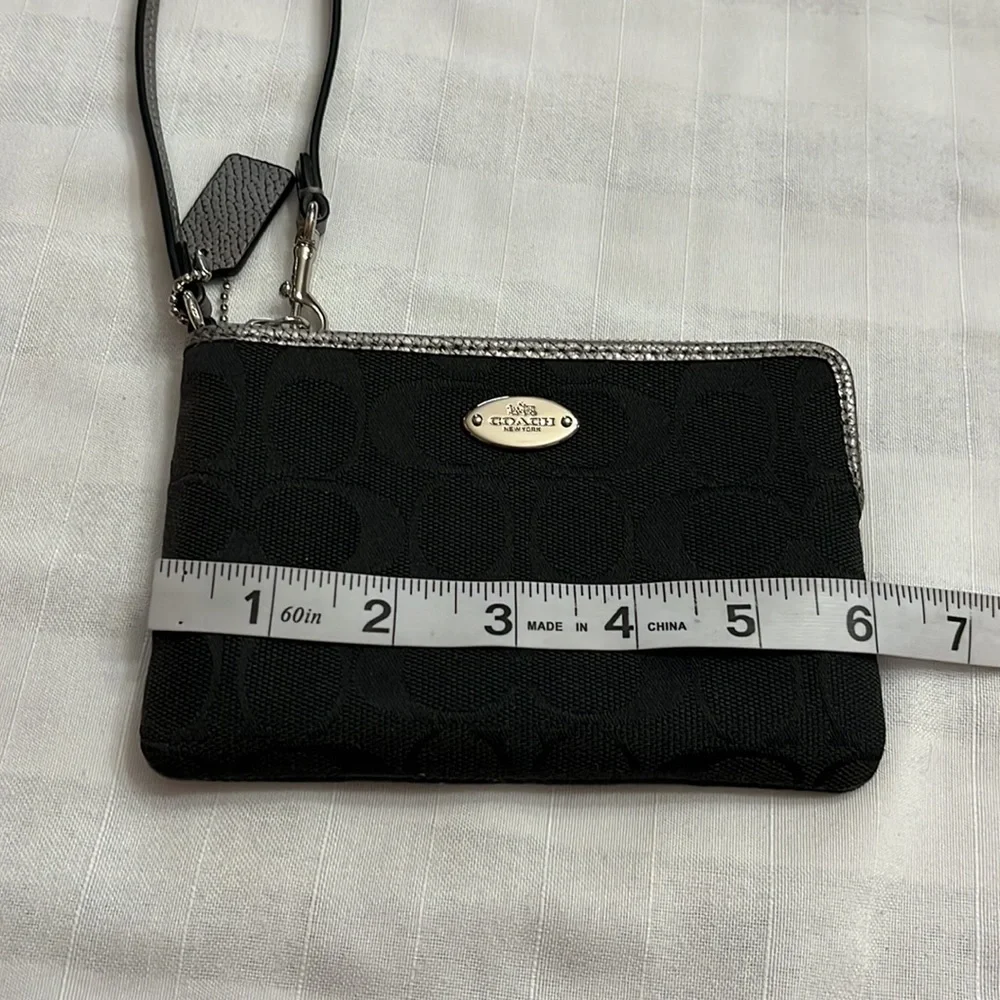 Coach black signature silver metallic leather edge wristlet